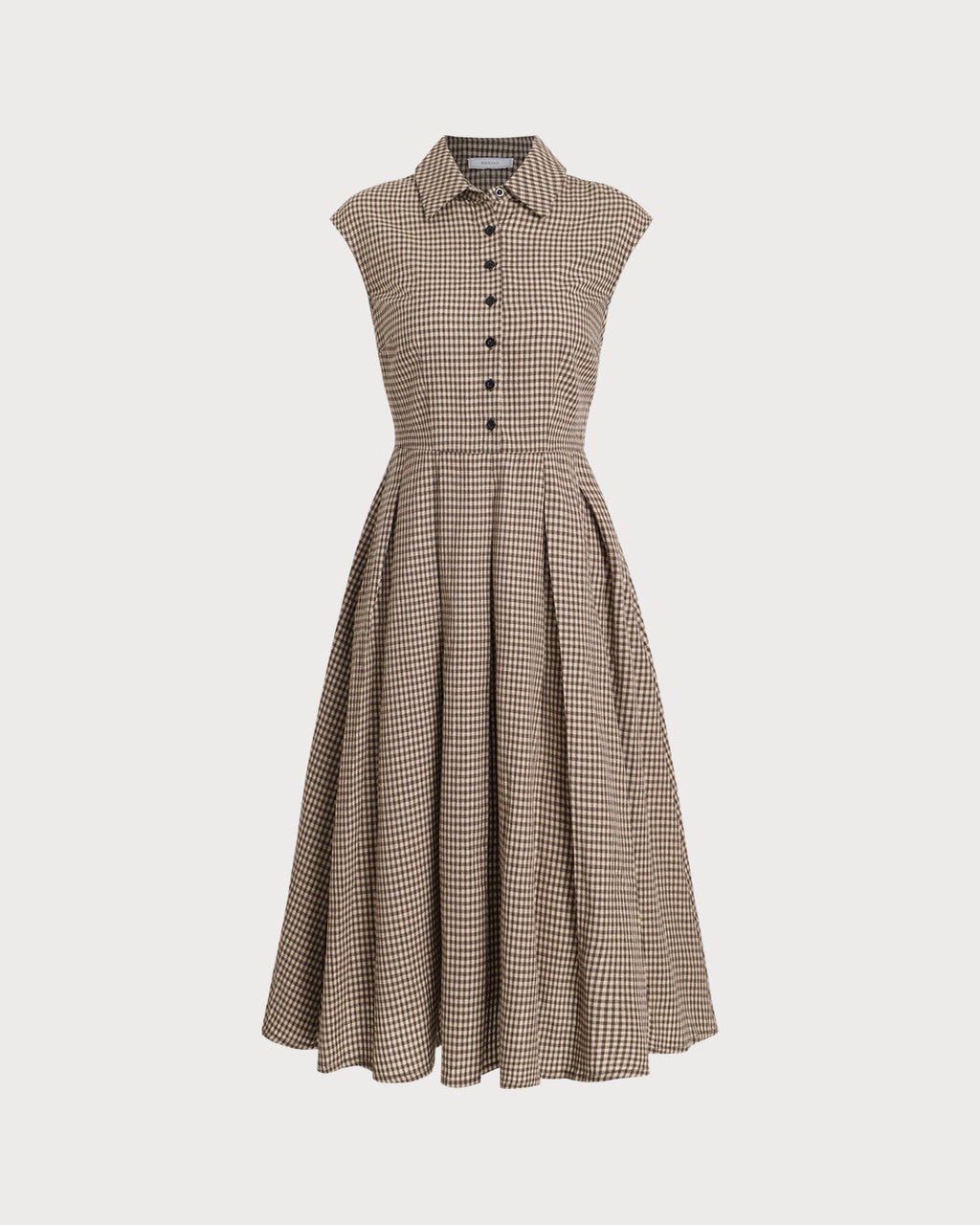 Detalle de la falda plisada del vestido midi de cuadros