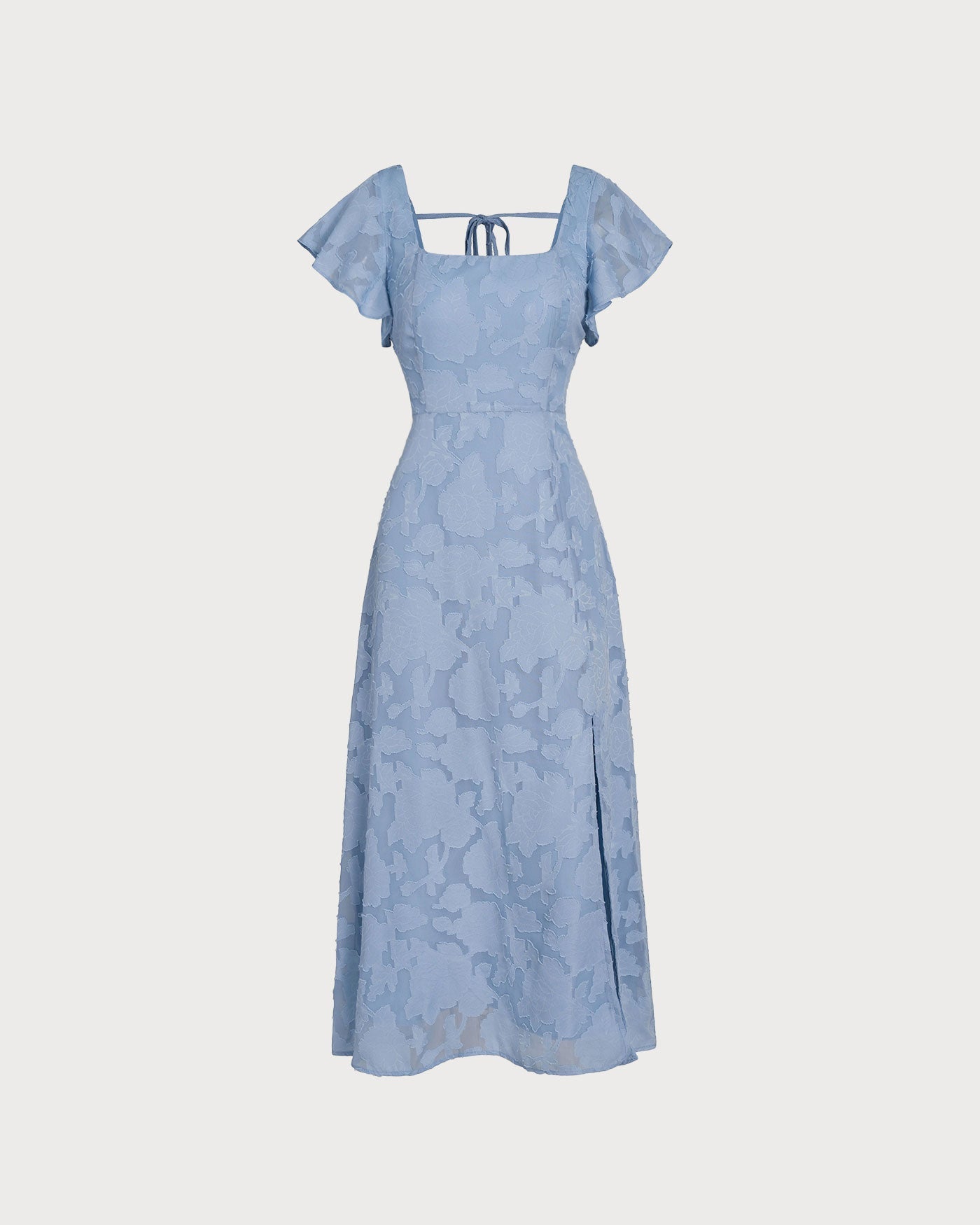Detalle del jacquard floral tejido del vestido midi azul Teresa